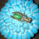 Antique cicada brooch with green stone cabochon