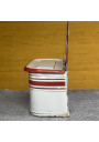 Antique white and red enameled tin matchbox