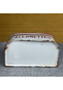 Antique white and red enameled tin matchbox