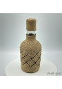 Petite bouteille vintage recouverte de raphia